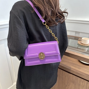 Elegant purple leather crossbody square bag with gold chain strap and vintage metal buckle