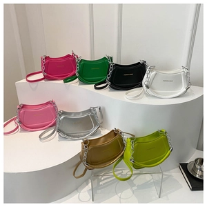 Detailed collection of minimalist half-moon bags with bold metal chains in various colors
