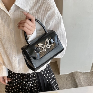 Elegant black faux leather crossbody bag with silver butterfly clasp for women