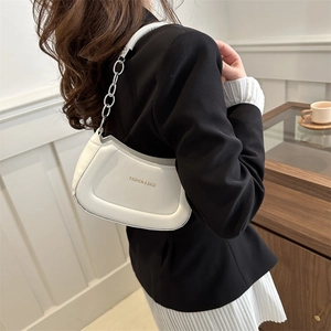White faux leather crescent shoulder bag with gold logo and silver chain strap