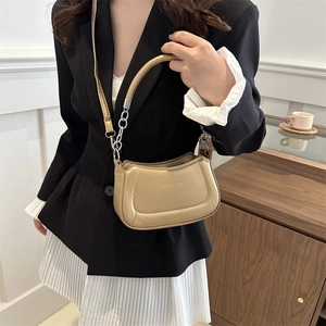 Champagne gold mini underarm bag with metal chain handle and leather strap for women