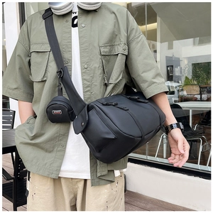 Detail of waterproof nylon gym bag with adjustable strap and side coin pouch accessory
