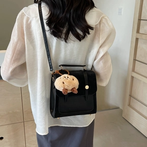 Retro black crossbody bag in faux leather and velvet with a cute cookie charm pendant