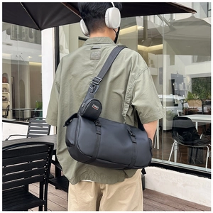 Detail of multi-functional black sports crossbody bag with adjustable nylon shoulder strap