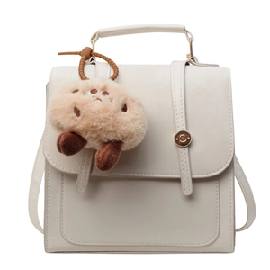 Vintage college style off-white backpack with gold buckle and cute cookie charm