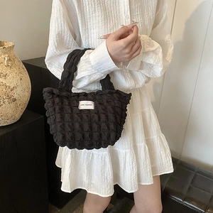 Minimalist black bubble texture tote bag with Love Fashion label for casual commute