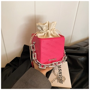 Detail of pink rich rabbit bucket bag with silver chain and white drawstring
