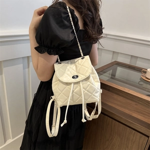 Elegant beige quilted drawstring backpack for women with silver chain straps