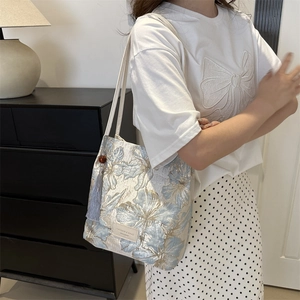 Sac fourre-tout à broderie florale et gland en velours violet, style élégant