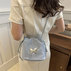 Light blue butterfly drawstring bucket bag with elegant metal chain shoulder strap for women