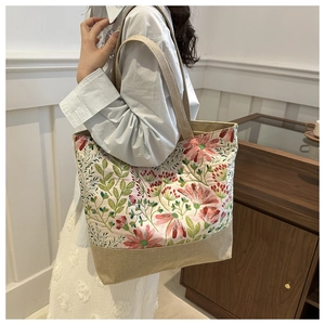 Floral print canvas tote bag detail showing khaki base and large storage capacity