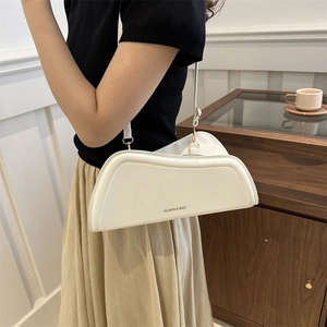 Minimalist white irregular leather crossbody bag for women with fashion branding