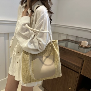 Bohemian style woven tote bag with leather patch and rope handles for beach and shopping