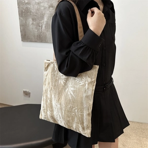 Chic velvet tote bag with bamboo leaf print and slender shoulder straps for daily commute