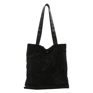 Minimalist black tote bag with embossed bamboo patterns and long leather handles