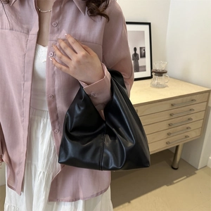 Minimalist black pleated faux leather handbag with integrated handle for women's daily commute