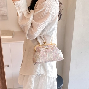 Vintage floral jacquard frame handbag with gold chain strap in a soft cream aesthetic