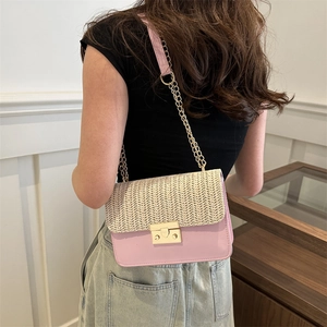 Pink faux leather and straw woven crossbody bag with gold chain strap for women