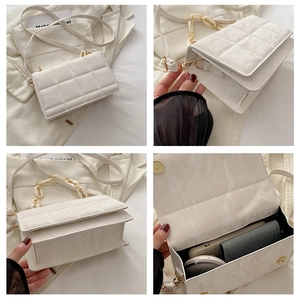 Detailed view of white marble pattern crossbody bag with rhombic texture and chain strap