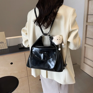Chic black glossy tote bag with bow detail and cloud charm for daily commute fashion