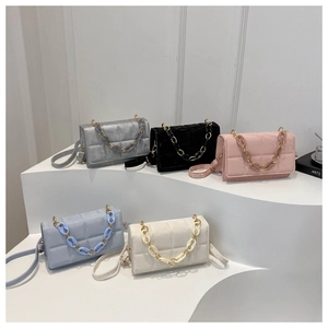 Detailed view of quilted small square bags in five colors with resin chain straps