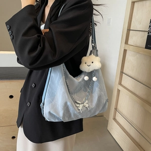 Light blue pleated tote bag with silver chain and cute plush cloud pendant on shoulder