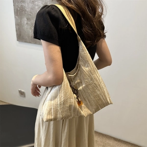 Minimalist light coffee shoulder bag with pleated texture and vintage knot detail