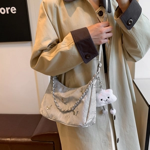 Silver satin hobo bag with butterfly charms and plush pendant for stylish women commute
