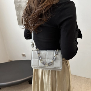 Chic silver grey quilted crossbody bag with stylish chain detail for modern women