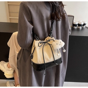 Fashion bucket bag featuring off-white herringbone fabric and cute cloud charm accessory