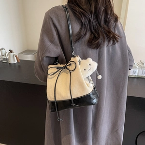 Minimalist herringbone bucket bag with black bow and plush bear charm for women