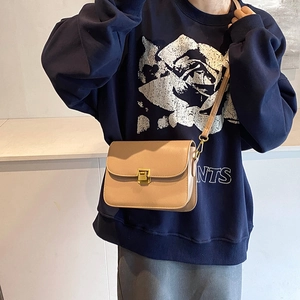 Minimalist beige rectangular flap crossbody bag with a square golden metallic buckle