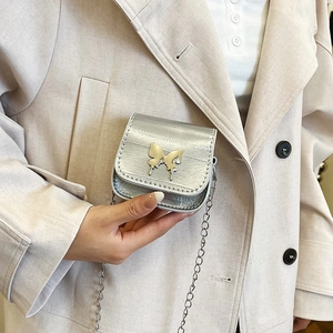 Mini silver metallic saddle bag with butterfly buckle and fine chain strap for women