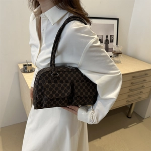 Vintage brown monogram underarm bag with front flap pockets for stylish commuting