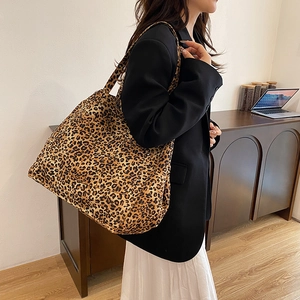 Vintage leopard print tote bag for women shown as a stylish shoulder bag in a home setting
