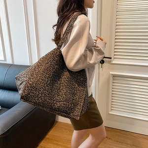 Large leopard print tote bag with outer pocket and rivets for casual daily commuting