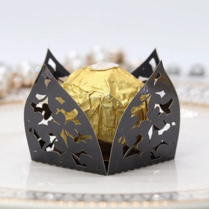 Elegant laser-cut black clover chocolate gift box with hollow floral pattern for weddings