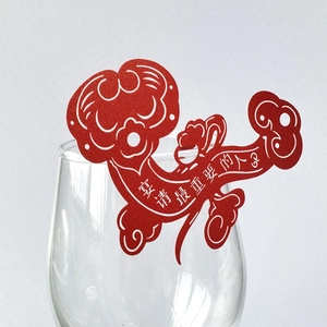 Red Chinese RuYi style wine glass place card with hollow pattern for festive wedding banquet