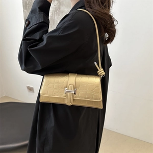 Champagne gold faux crocodile leather shoulder bag with square metal clasp and knot strap