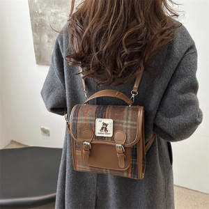 Retro plaid backpack with embroidered bear patch and brown leather accents for women