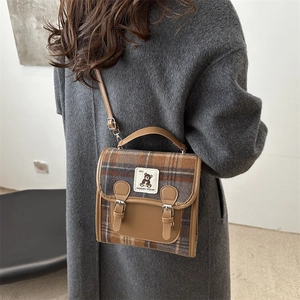 Retro plaid backpack with brown leather trim and bear patch for women's daily casual style