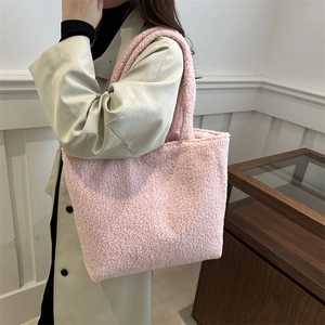 Pink sherpa fleece tote bag for women featuring a large capacity fuzzy shoulder design