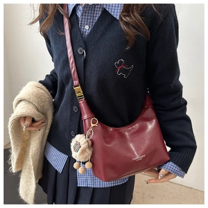 Burgundy moon crossbody bag with fashion logo and a cute white plush sheep charm