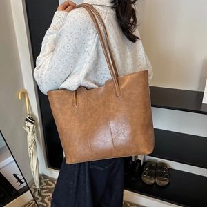 Minimalist large brown tote bag in vintage leather style for women winter fashion