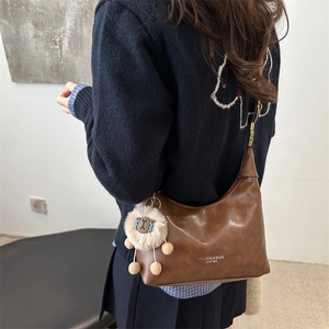 Brown vintage leather hobo bag for women with cute lamb pendant and fashion branding