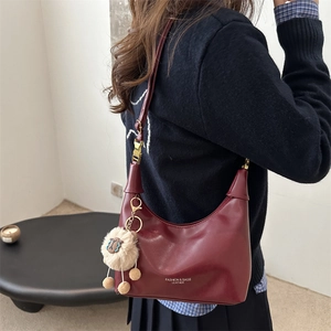 Chic burgundy Hobo shoulder bag for women with plush charm and glossy PU leather finish
