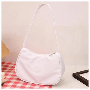 Detailed close-up of a white hobo bag showing smooth fabric and metal zipper closure