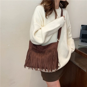 Vintage brown suede tote bag with fringe details and adjustable strap for women