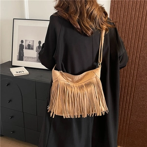Vintage brown suede shoulder bag with long fringes and adjustable strap for women