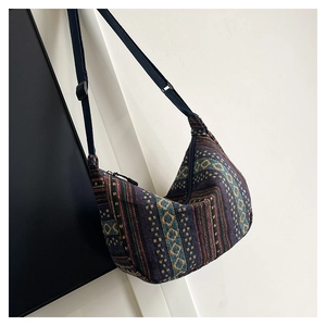 Close-up of ethnic style woven crossbody bag featuring colorful geometric patterns
